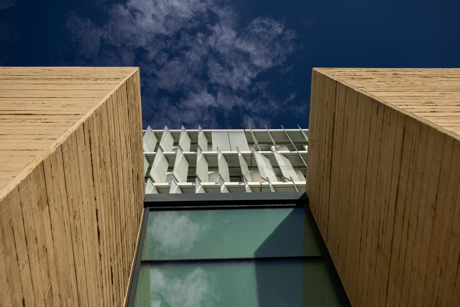 several cranes above the buildings